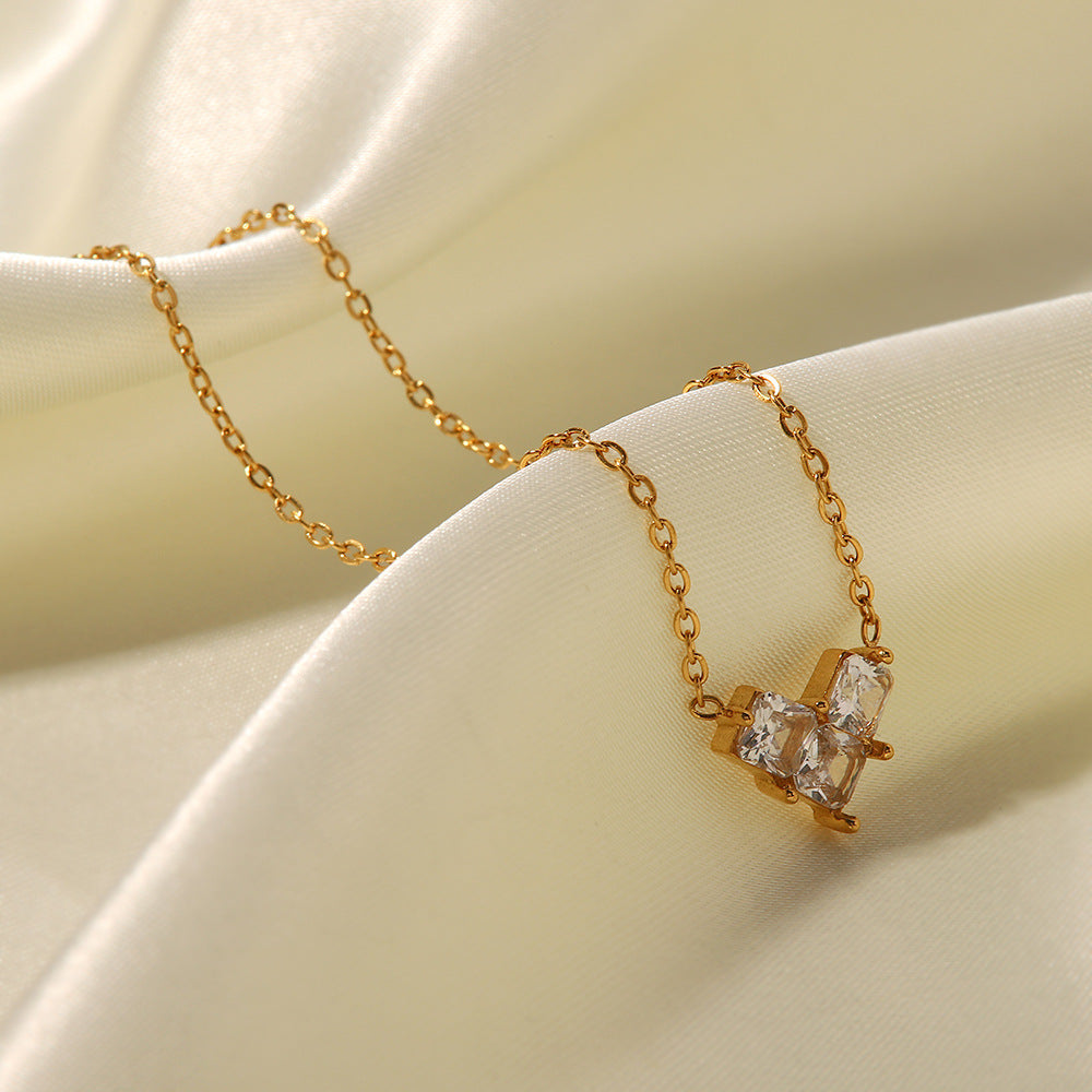 18K Gold Plated Love Pendant Necklace showcasing pink and white zircon on elegant chains.